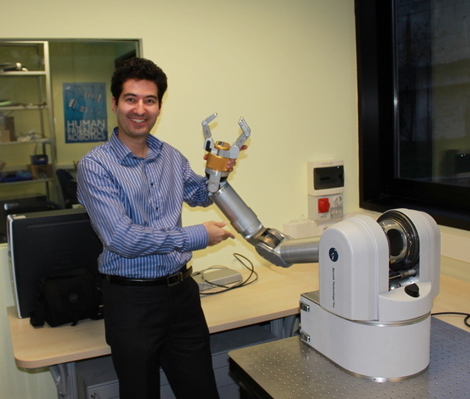Petar Kormushev doing experiments with Barrett WAM robot at IIT in Genoa, Italy